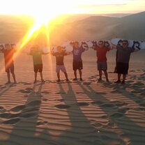 students sand boarding in Ica during one of the three included excursions planned during the semester Excursion to Ica - Study Abroad EdOdyssey